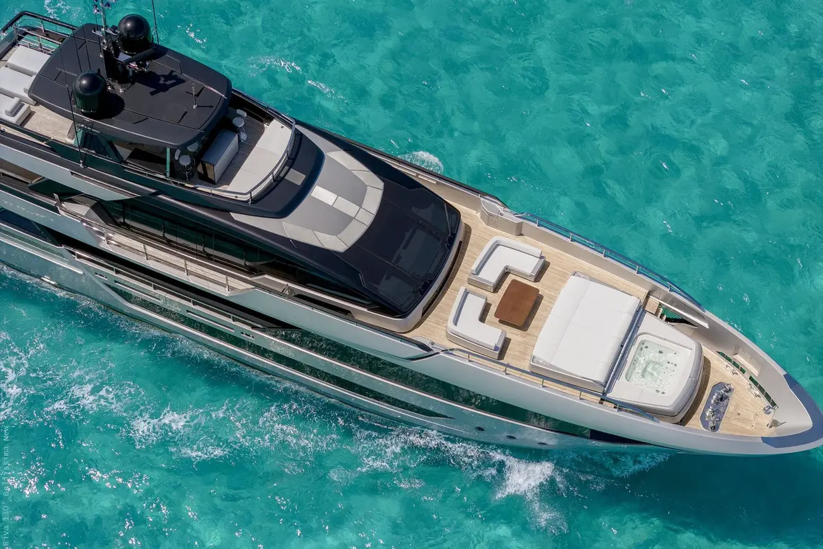 Riva 130, salon — Priveo Yachts, Europe. Wide teak decks and five staterooms for close groups
