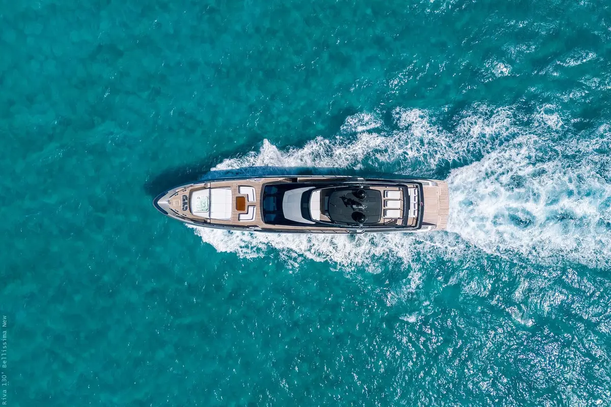 Riva 130, flybridge — Priveo Yachts, Europe. Wide teak decks and five staterooms for close groups